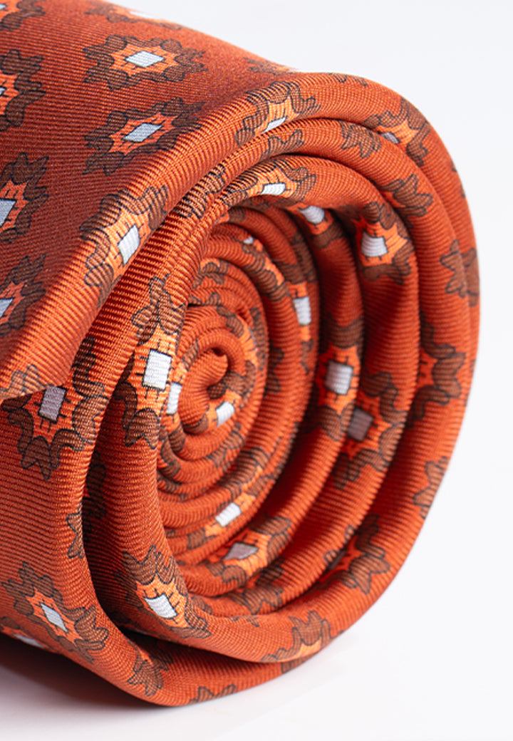 Cravatta uomo in pura seta arancione ruggine con fantasia geometrica