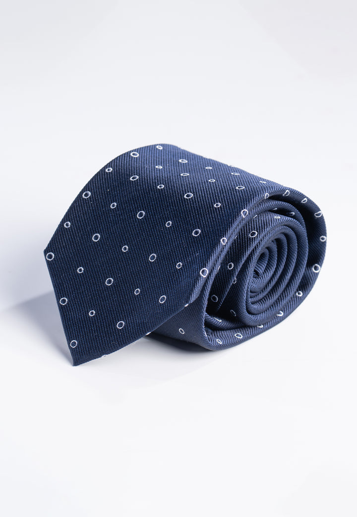 Cravatta uomo blu con fantasia ad anelli bianchi in pura seta