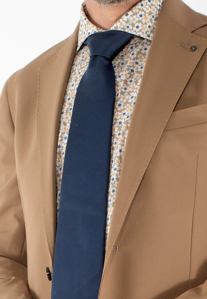 Cravatta uomo blu con micro puntini bianchi in pura seta