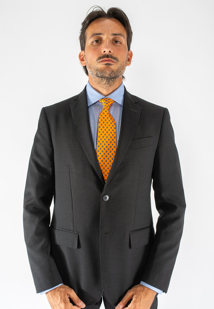 Cravatta uomo arancione con fantasia geometrica blu in pura seta