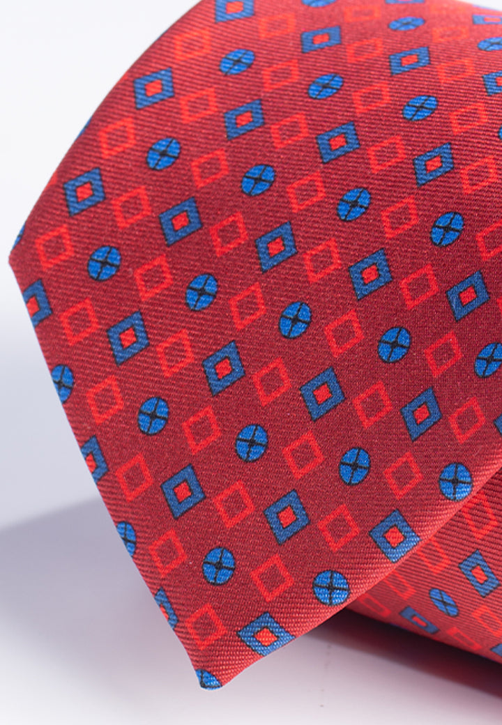 Cravatta uomo rossa con fantasia geometrica blu in pura seta